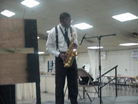 [Photo 3: Mr. Clinton Johnson playing his 'soulful sax']