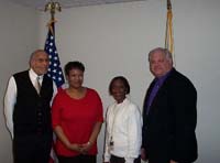 [Photo: Pictured left to right; Mr. Booker, Mary Wilson, Director CPD, Terry Carroll CPD, and Mark Brezina, Field Office Director]