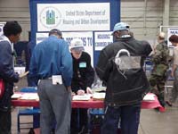 [Photo 2: HUD Volunteer Terry Livingston, provided rental and transitional housing information to Vets]