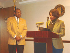 [Photo 1: Marsha Webb, presents Field Office Director, Bill Dirl a Certificate of Appreciation]