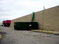 [Photo 1: a very bleak looking cement block building]