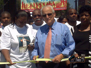 [Photo 1: Congressman Bill Pascrell, Newark Field Office Director Diane Johnson and Trani Williams mother of Percival Williams cut the ribbon on the refurbished basketball court.]