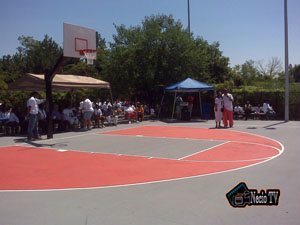 [Photo 3: Residents of Speer Village view the renewed recreational facility]