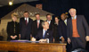 [Photo: President Bush sign into law the American Dream Downpayment Act]