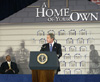 [Photo: President Bush at the podium]