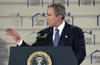 [Photo: President Bush at the podium]