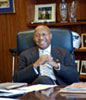 [Photo: Secretary Jackson sitting at his desk]