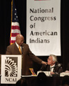 [Photo: Secretary Jackson greets Joe Garcia, President of the National Congress of American Indians meeting during his remarks in Washington, D.C.]
