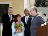 [Photo: Secretary and U.S. Congressman Mike Sodrel greeting first time homeowners Lori and Donald Sears]