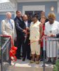 [Photo: Secretary Jackson with Bob Greer, President-Michaels Development Company ; Mayor Ray Nagin, New Orleans city officials and new Desire residents Gladys Nichols and Myrtis Jones do a ribbon cutting opening a new residence in the Ninth Ward Grand Opening of the New Desire]