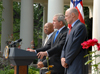 [Photo: HUD Secretary Jackson (left), President Bush (center), and Henry Paulson Jr. (right)]