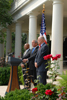 [Photo: HUD Secretary Jackson (left), President Bush (center), and Henry Paulson Jr. (right)]